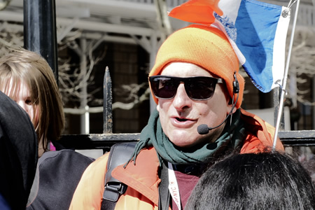 Jared On a Walking Tour in NYC holding the flag of New YOrk City