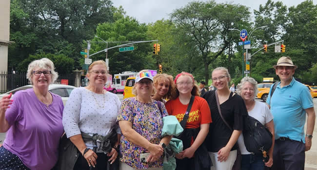 Walking Tour Group with Jared enjoying NYC and smiling